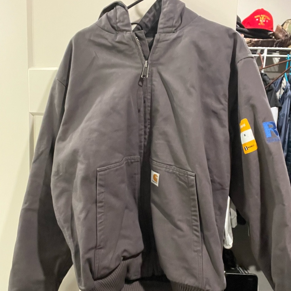 Men’s medium Carhartt coat with small company logo